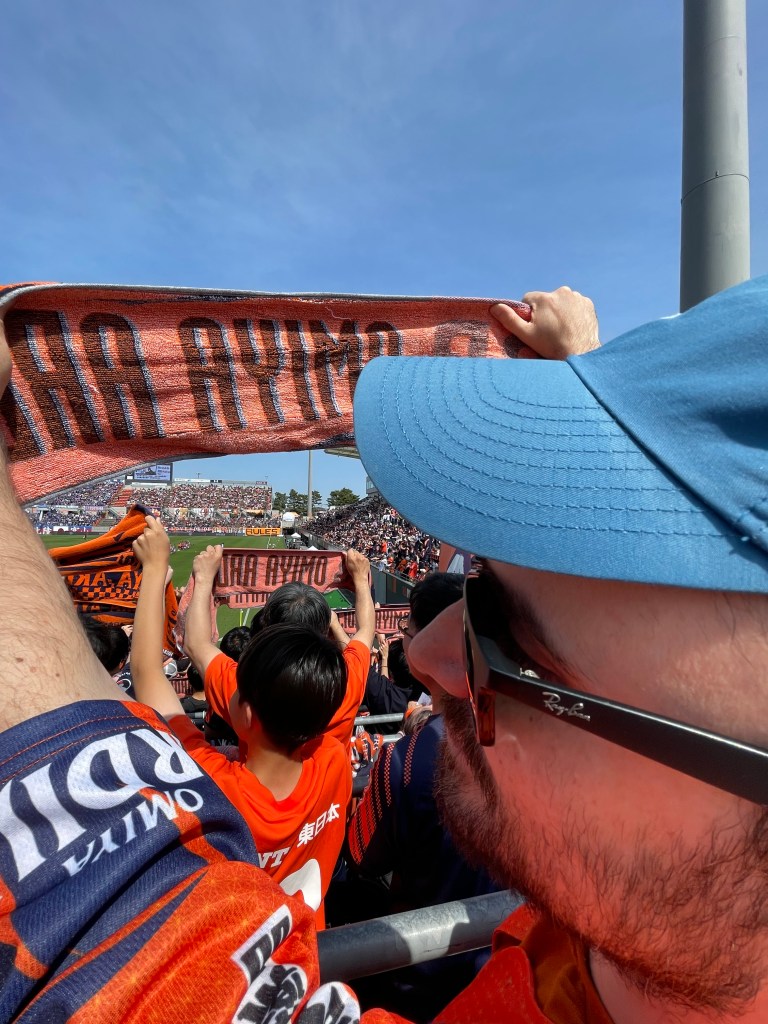 Antonio holding the Omiya Ardija scarf